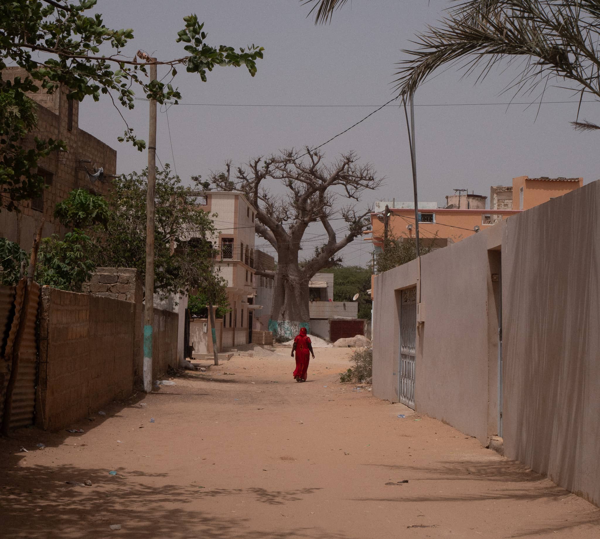 A woman walking in Thiès-Nones, Senegal